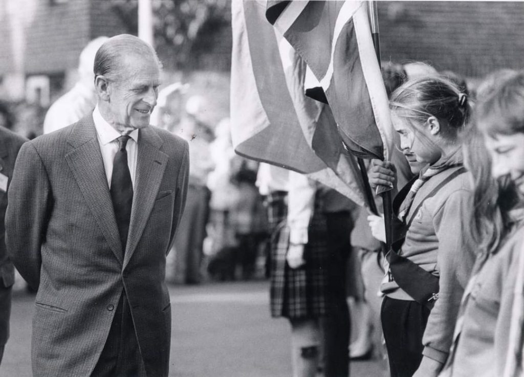 HRH Prince Philip, The Duke of Edinburgh, inspecting some youth groups with flags.