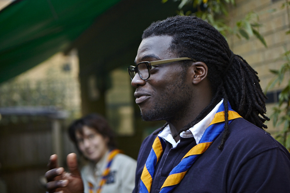 A black leader with a group of Scouts