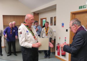 Richard Spearing, a volunteer from Portsmouth, receives his 50 year Long Service Award surrounded by friend and colleagues from Hampshire Scouts Heritage.