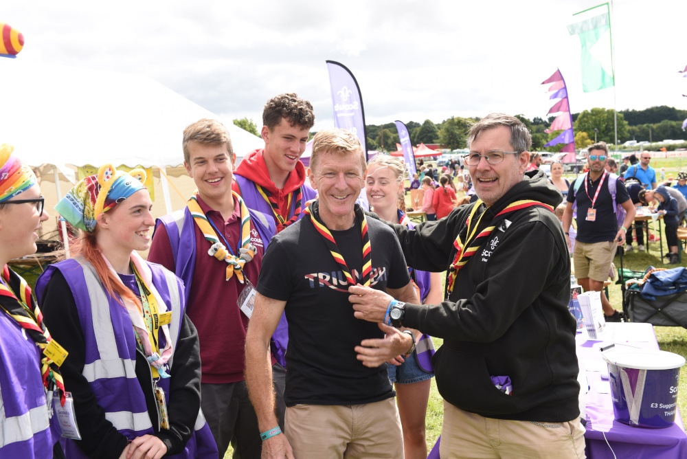 Astronaut and Scout Ambassador Tim Peake is presented a Hampshire Scout necker by Keith Hawkins, lead volunteer for Growth and Development at Hampshire Scouts. Tim was visiting the Hampshire Scout Camp Live at CarFest to say thank you to the many volunteers and Young Leaders who help deliver #SkillsForLife to our young people.